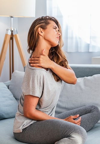 A young woman with neck pain